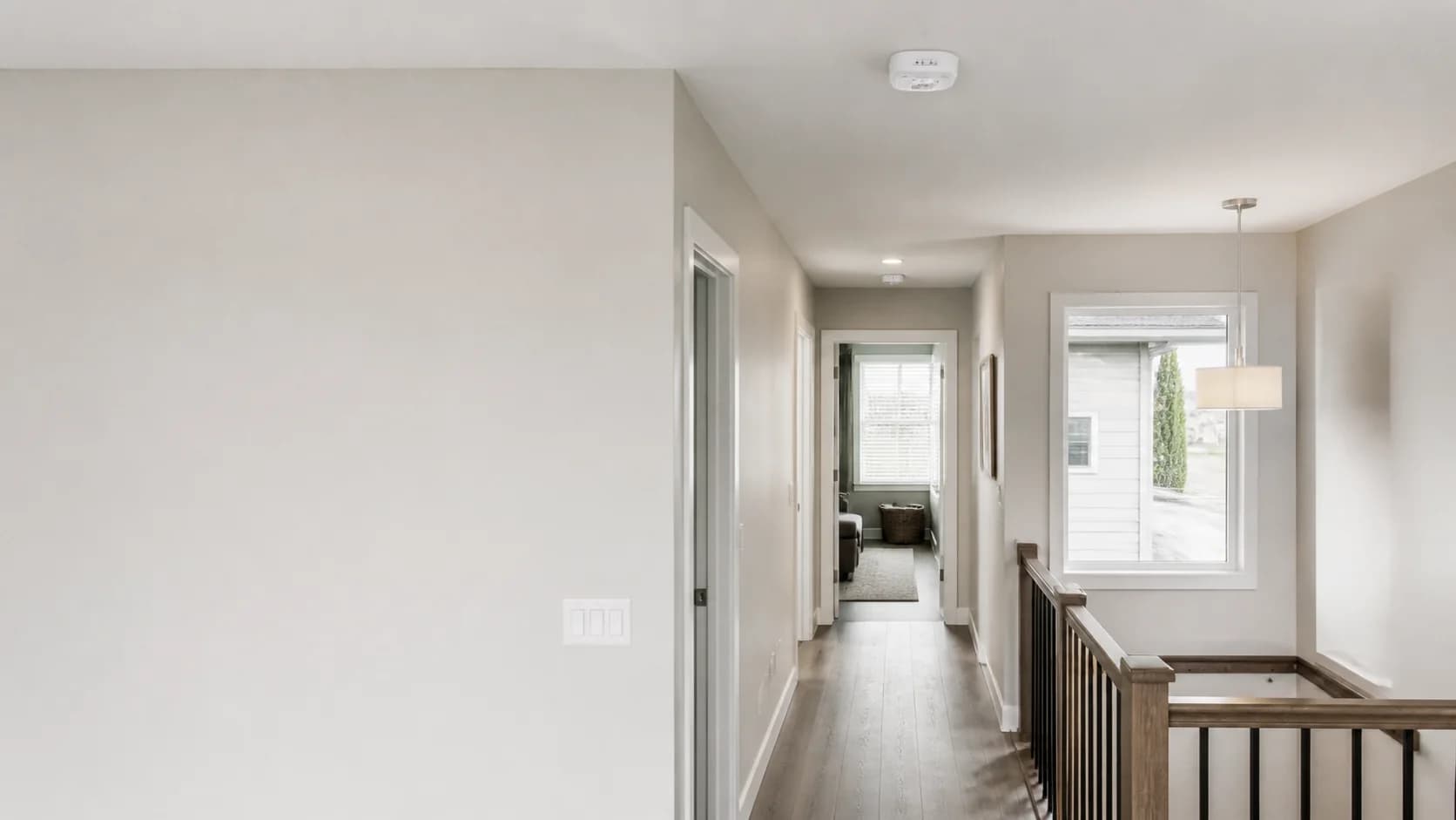 Interconnected smoke and carbon monoxide alarms installed in a Calgary home hallway