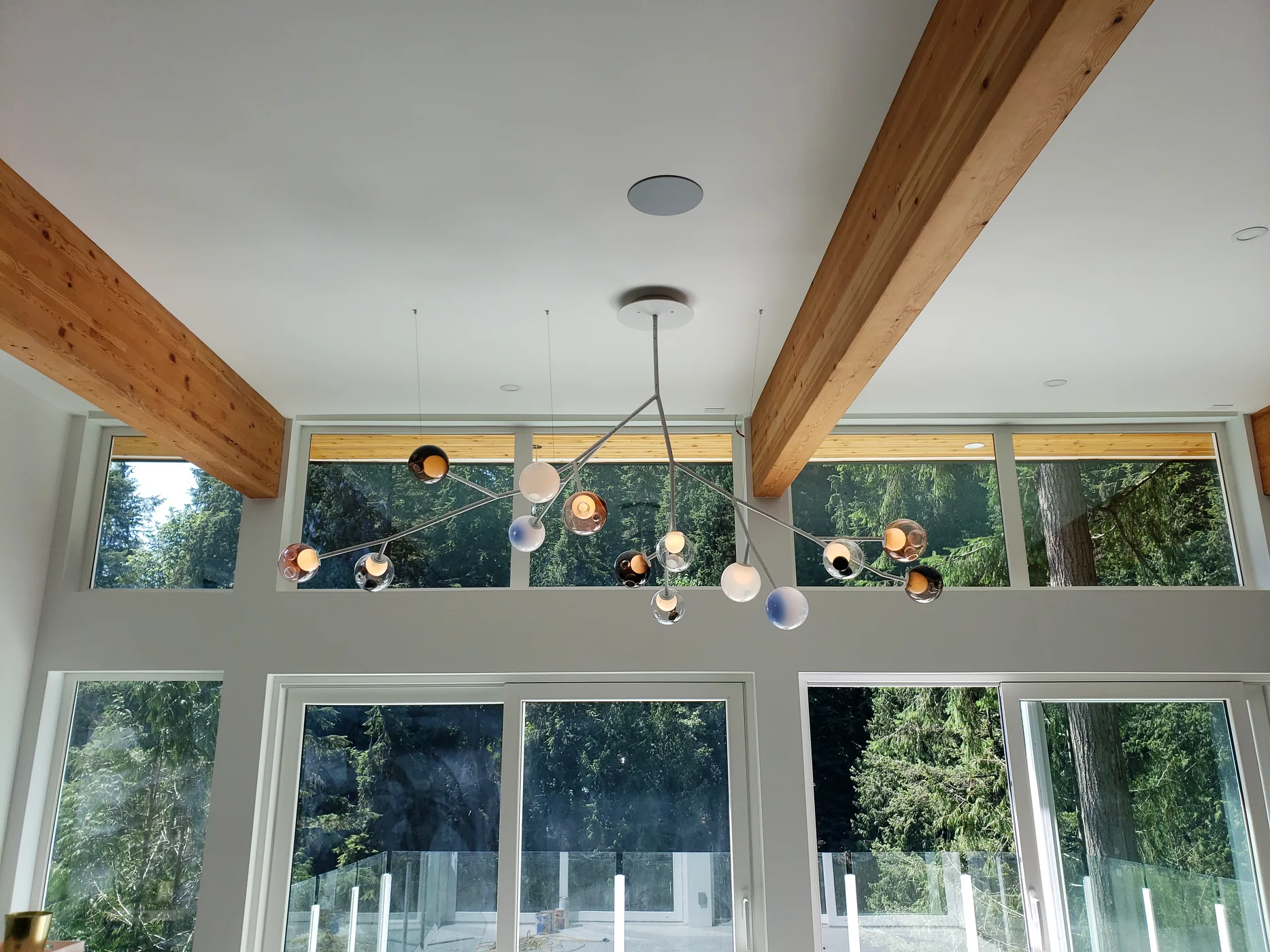 Decorative residential lighting installed in a timber-beam home by Verity